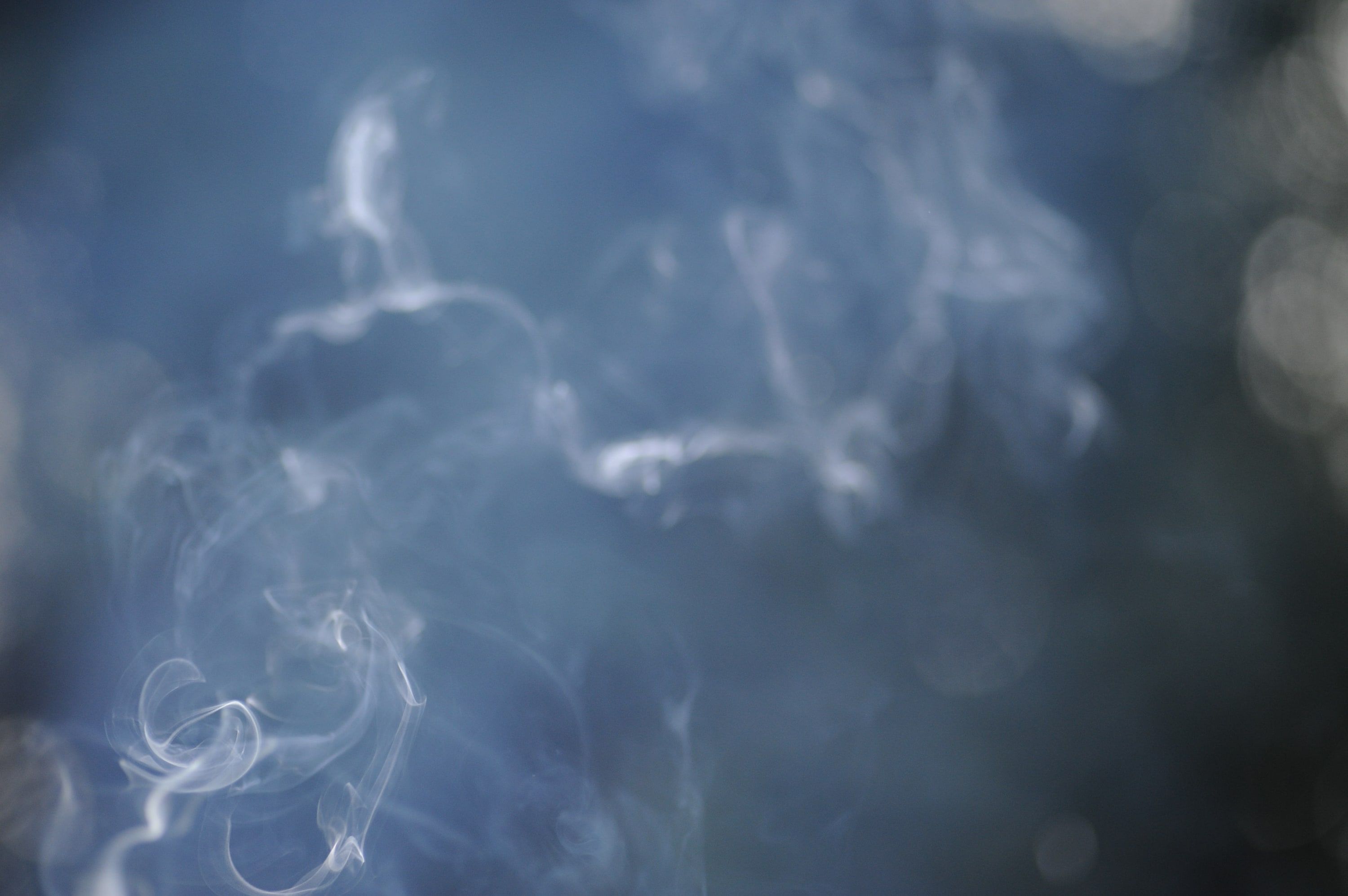 6:26 pm: f/3.2. The flash freezes the smoke, but the background is still there.